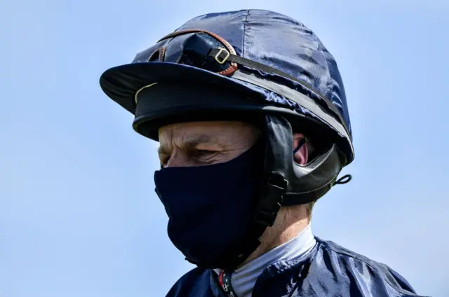 Jockey in face mask