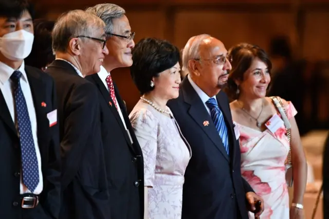 Hong Kong pro-Beijing legislator and former security chief Regina Ip (C) poses with other guests as they attend a gathering following a flag-raising ceremony to mark China's National Day celebrations in Hong Kong on July 1, 2020.