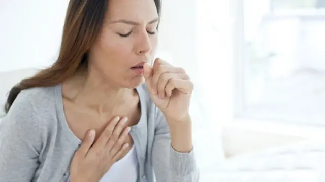 Woman coughing