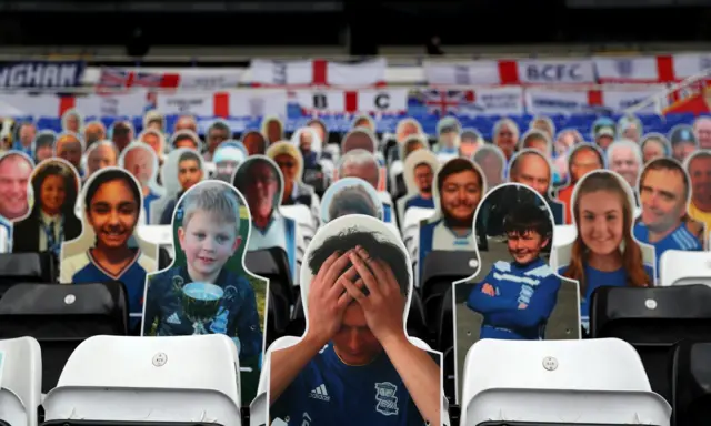 Cardboard cut-outs of Birmingham fans