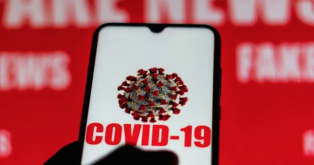 The words Covid-19 on a mobile screen