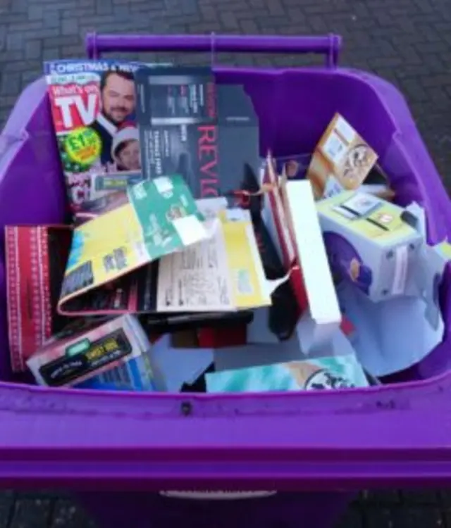 Card in a purple bin