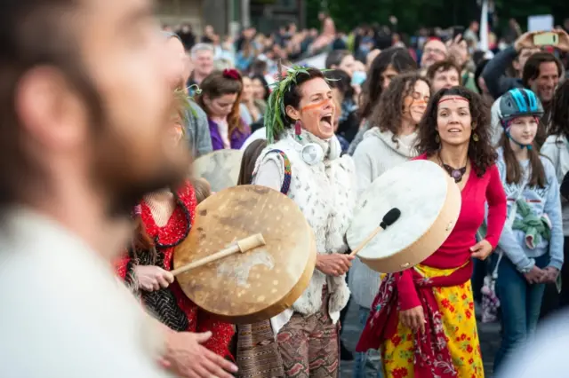 Slovenian citizens sing and dance during a protest against the centre-right government,