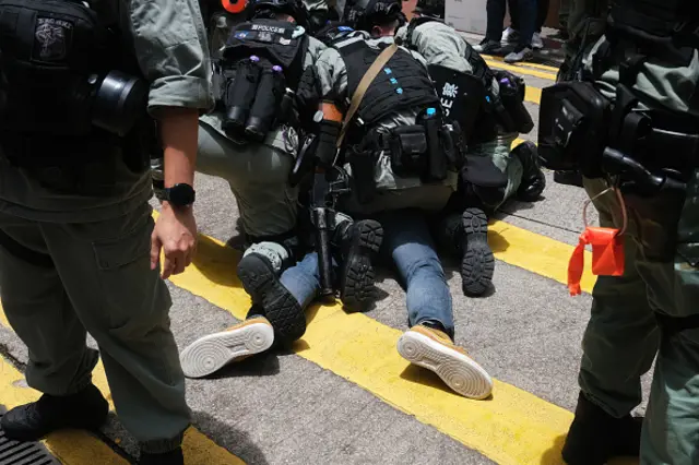 Riot police arrest Andrew Wan, a pro-democracy lawmaker