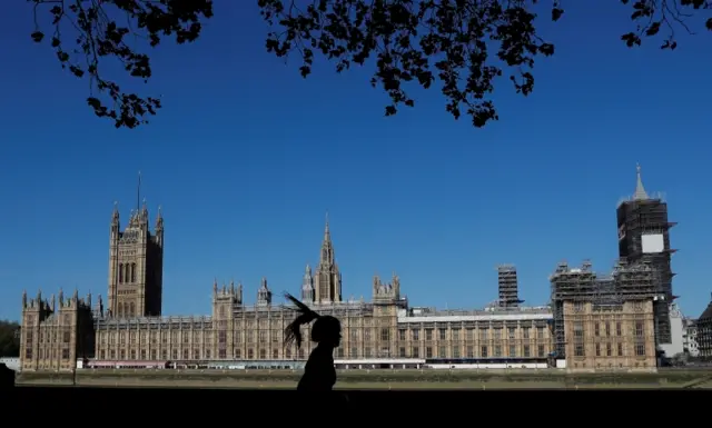 Runner passes Houses of Parliament