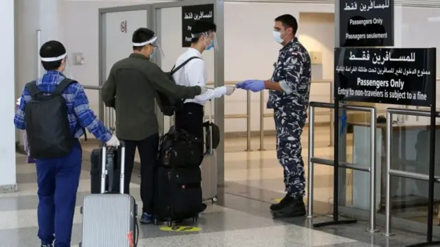 Passengers have their passports checked at Beirut International Airport (1 July 2020)