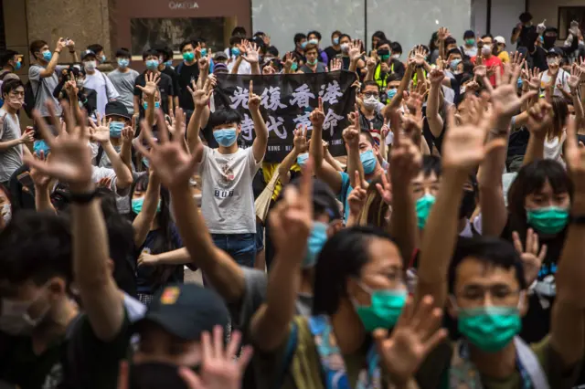 Protesters chant slogans during a rally against the new national security law