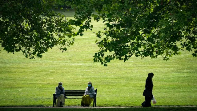 Women wearing masks at a park in Leicester