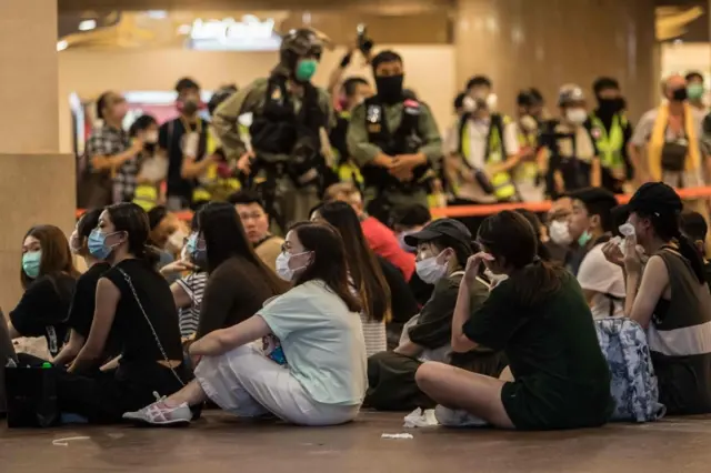 Riot police detain people after they cleared protesters taking part in a rally against a new national security law in Hong Kong on July 1, 2020