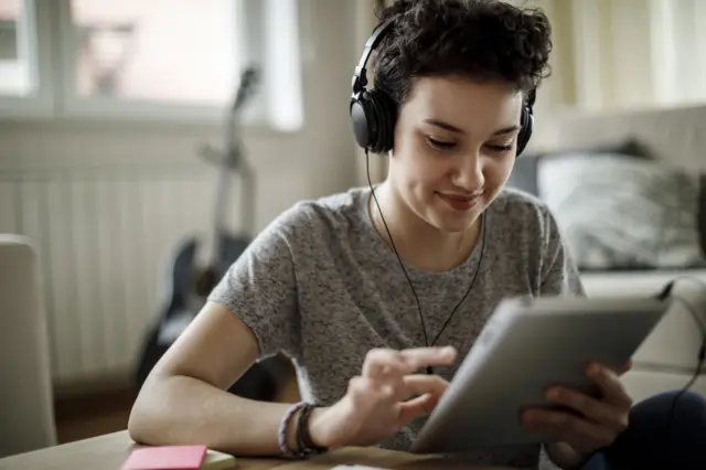 young person completing a survey