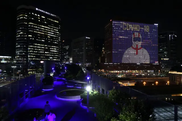 The Seoul Square Building is illuminated to show messages of hope