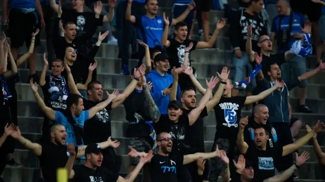 Supporters of Levski Sofia cheer their team during the national championship's football match between Levski Sofia and Ludogorets Razgrad in Sofia, Bulgaria on June 5, 2020