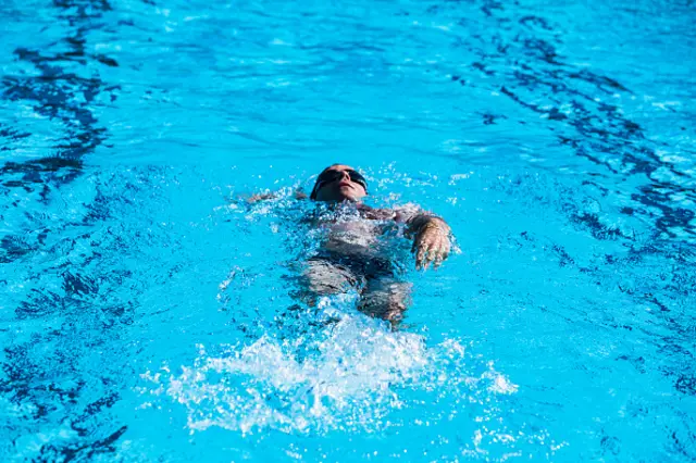 Man swimming in pool