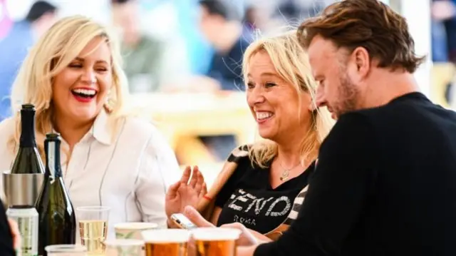 People enjoying some drinks outside in a beer garden