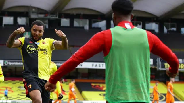 Watford's Troy Deeney celebrates after scoring his second penalty