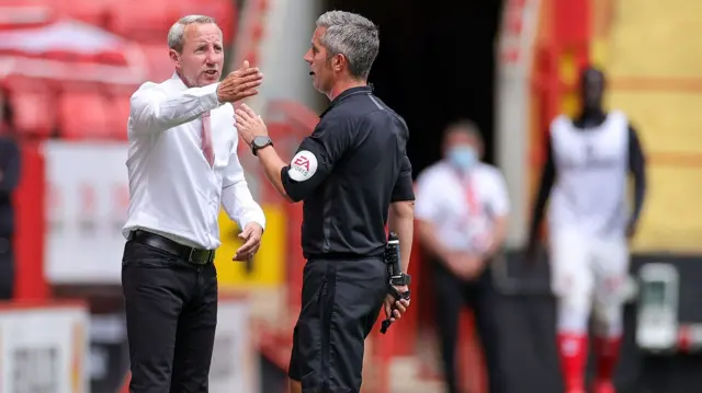 Lee Bowyer speaks to the referee