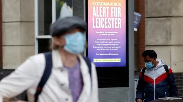 A man wearing a mask in Leicester