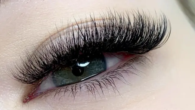 A close-up on lashes on an eye