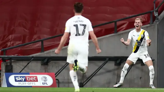 Mark Sykes celebrates his goal for Oxford