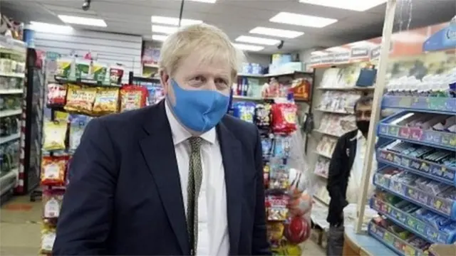 Prime Minister Boris Johnson wearing a mask