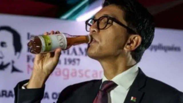 President Rajoelina drinking Covid-Organics in May 2020