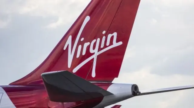 A Virgin aircraft on an airport runway