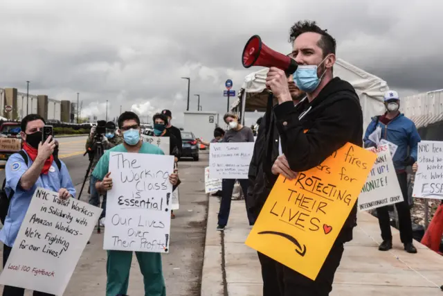 People protest working conditions outside of an Amazon warehouse fulfillment center