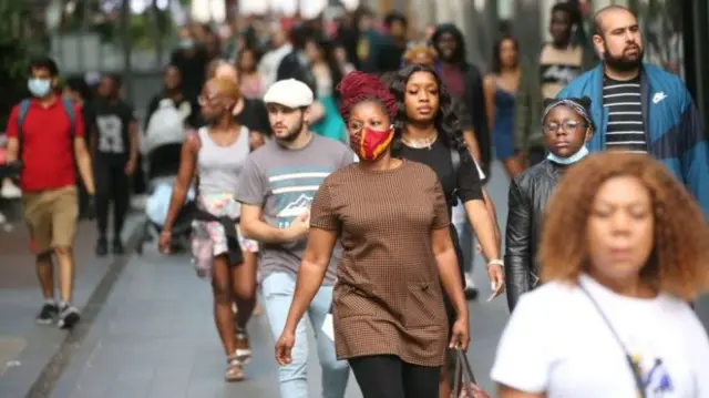 People walking down a high street