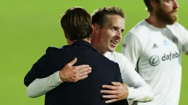 Scott Parker hugs Stefan Johansen