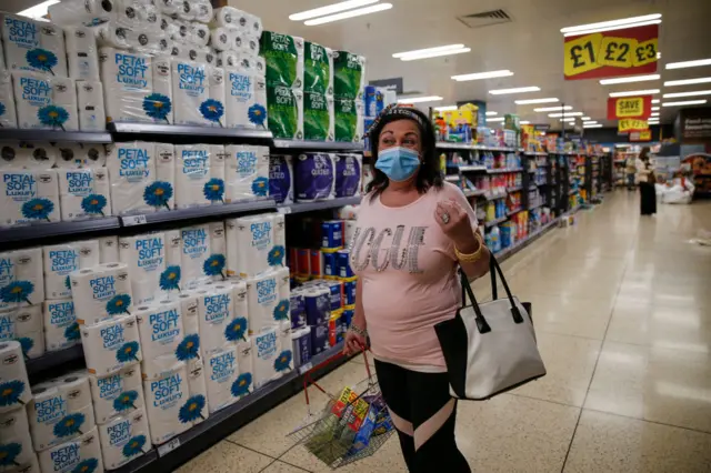 Woman wearing face mask in a supermarket