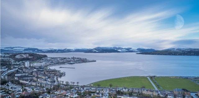 The scene from Lyle Hill Greenock looking over Gourock and onto Gareloch and its hillside covered in Snow. A long exposure to give a soft and etherial look.