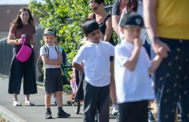 Parents and pupils queue