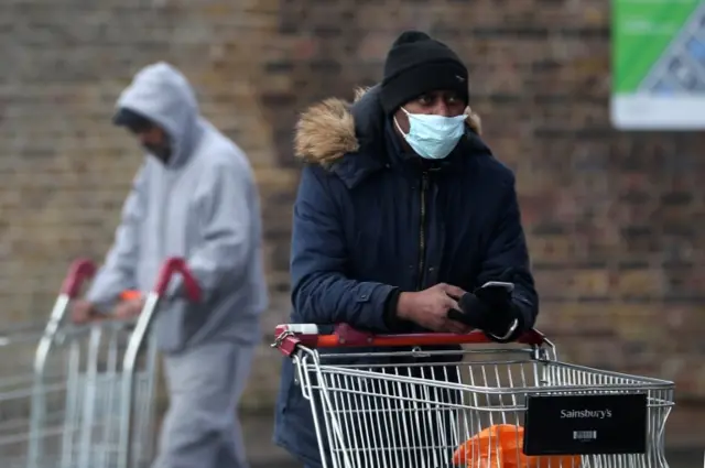 Shoppers in masks