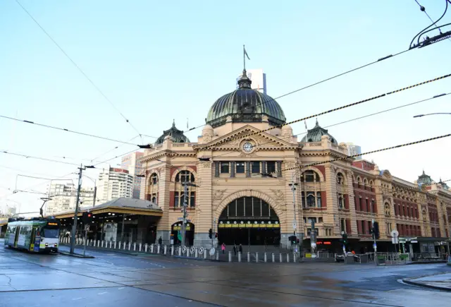 Melbourne's Flinders St and Swanston St intersection, shown with few people