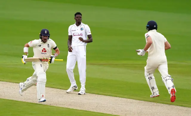 West Indies' Alzarri Joseph (centre) looks on as England's Rory Burns (left) and Dom Sibley score runs during day one of the Second Test at Emirates Old Trafford, Manchester.