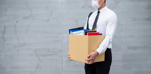 Stock image of man losing job during pandemic