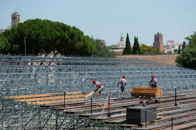 Workers build a seating area for socially distanced Rome Opera House's summer performances at Circus Maximus