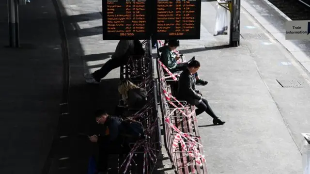 At Clapham Junction station some seats are taped off to keep people apart