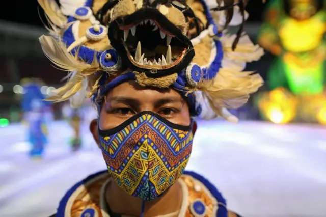 A dancer poses for a portrait during a live streaming replacing the traditional Boi-Bumba folklore festival, cancelled amid the new coronavirus pandemic in Parintins, Amazonas state, Brazil, on June 27, 2020.