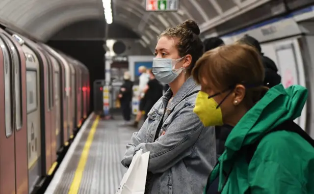 People travelling on the London Underground