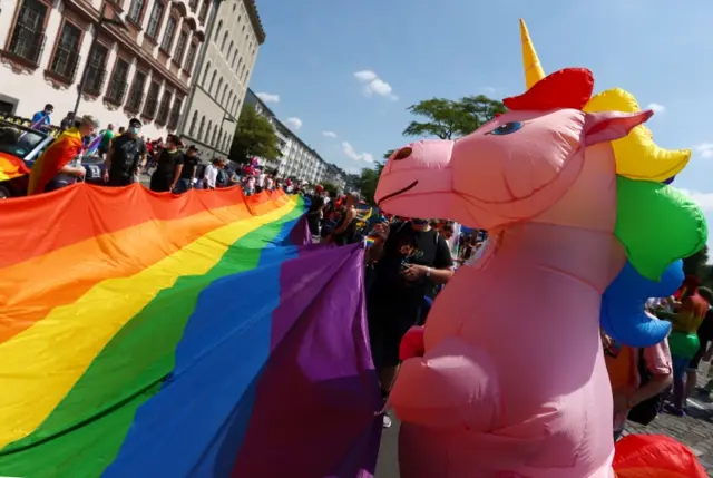 A pride flag and inflatable unicorn pictured at the event