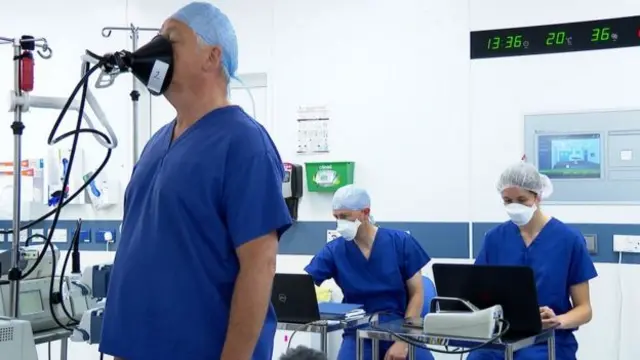 A man singing down a tube