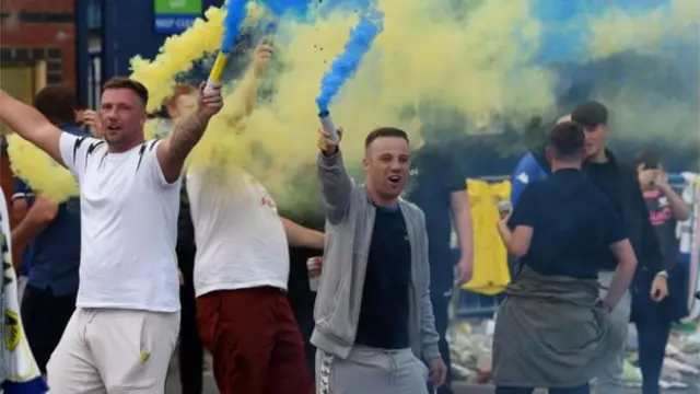 Fans celebrate Leeds's promotion to the Premiership