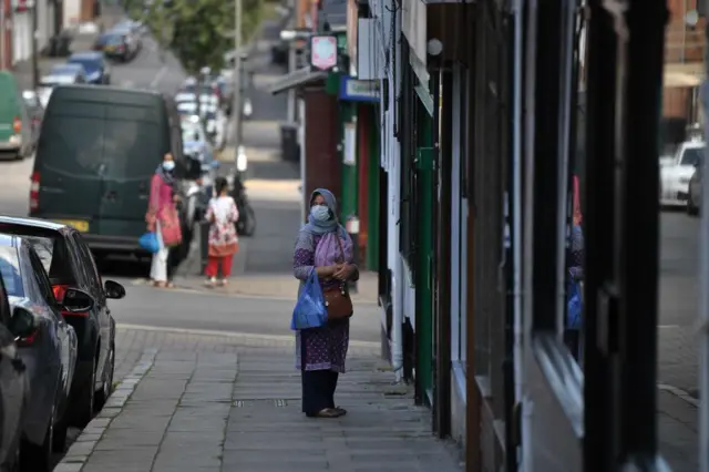 A woman with a face mask in Leicester