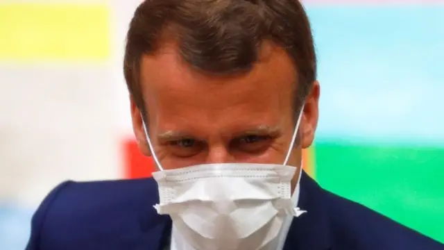 President Emmanuel Macron in a mask