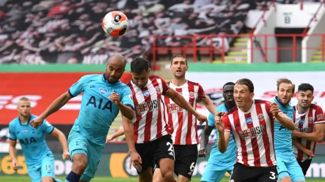 Lucas Moura of Tottenham Hotspur battles for possession