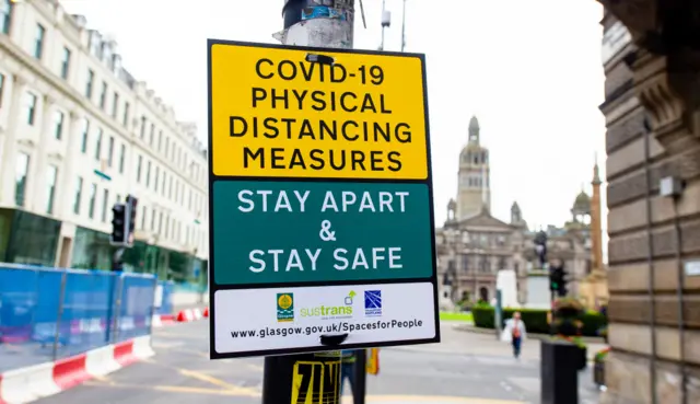 Social distancing sign in Glasgow's George Square