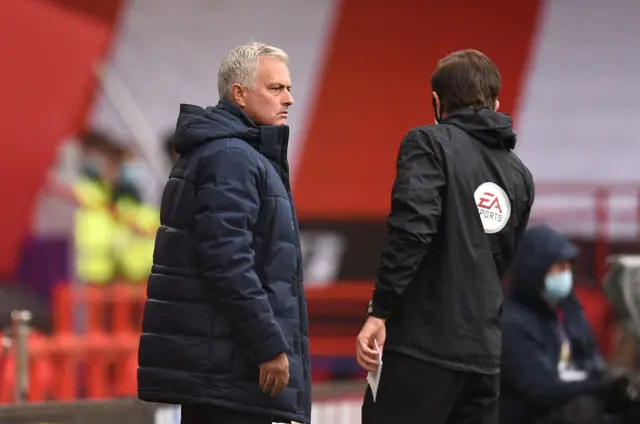 Tottenham Hotspur manager Jose Mourinho speaks to the fourth official