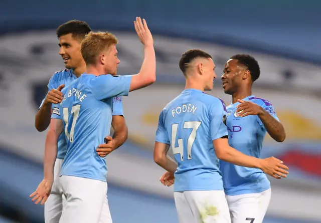 Raheem Sterling of Manchester City celebrates with his team mates