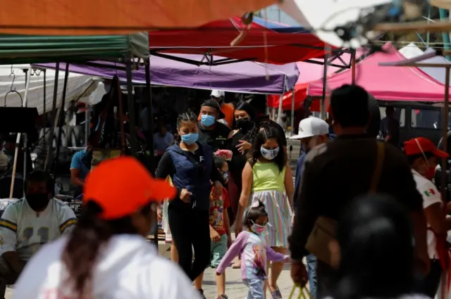 People in face masks shop in El Salado market in Iztapalapa, Mexico City, Mexico, on 1 July 2020